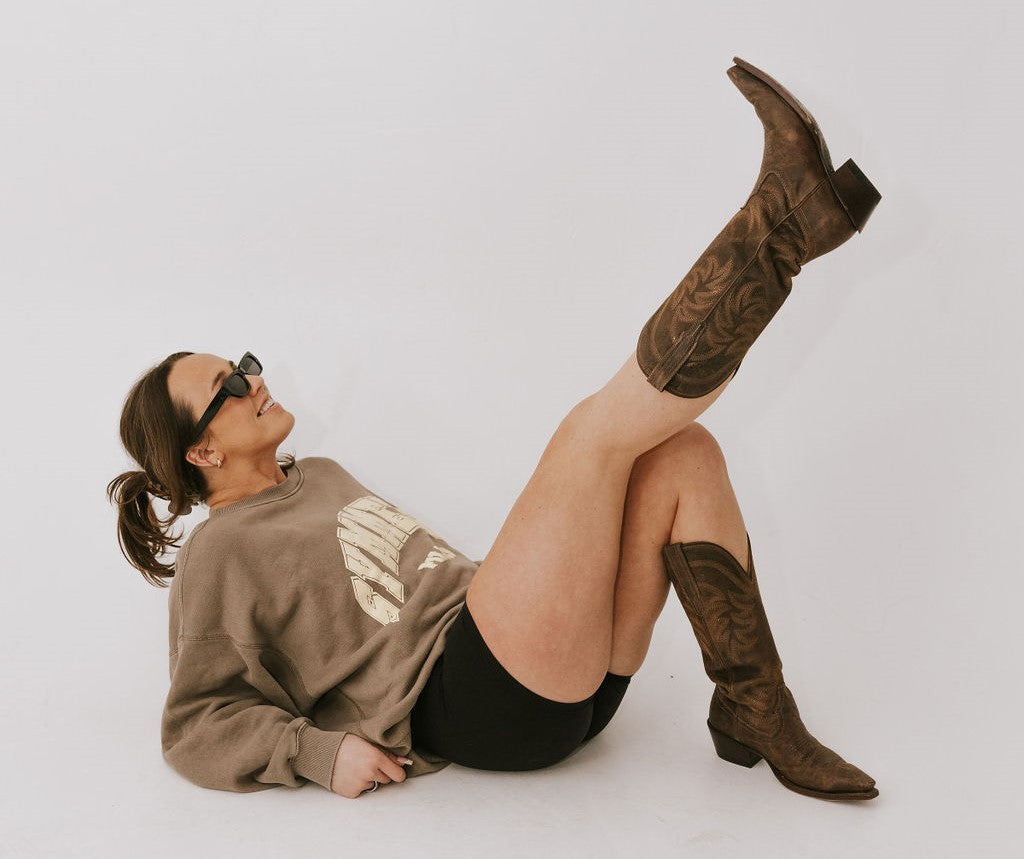 Cozy crew neck and cowboy boots